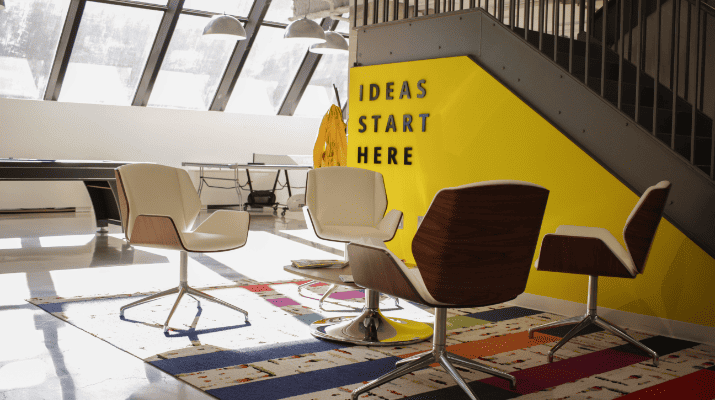 chairs placed in front of a wall with text ideas start here